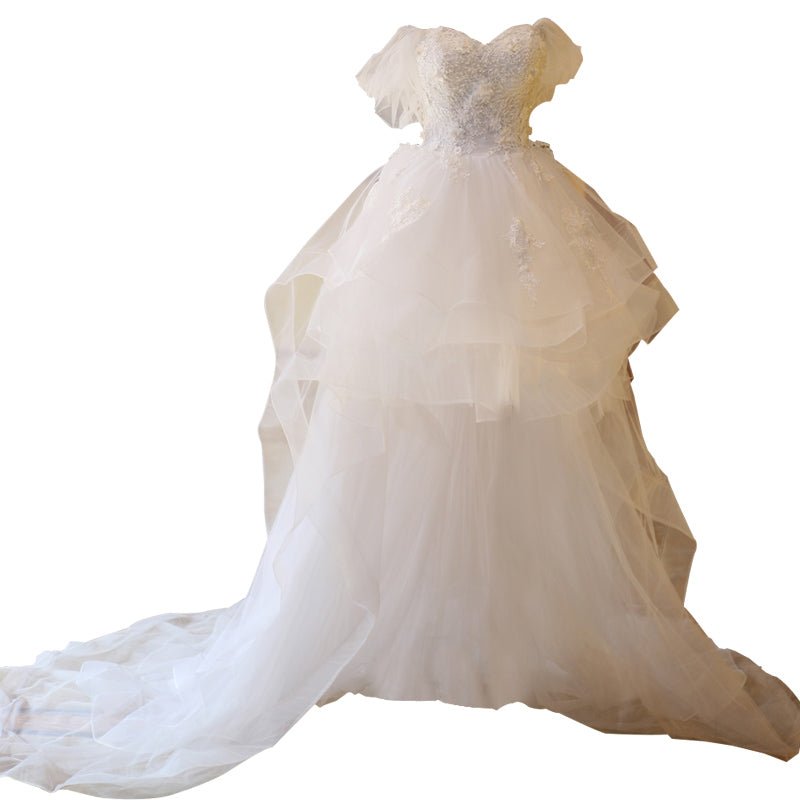The Bride'S Wedding Dress With Long Tail In Front Of The Studio - RICALOUX
