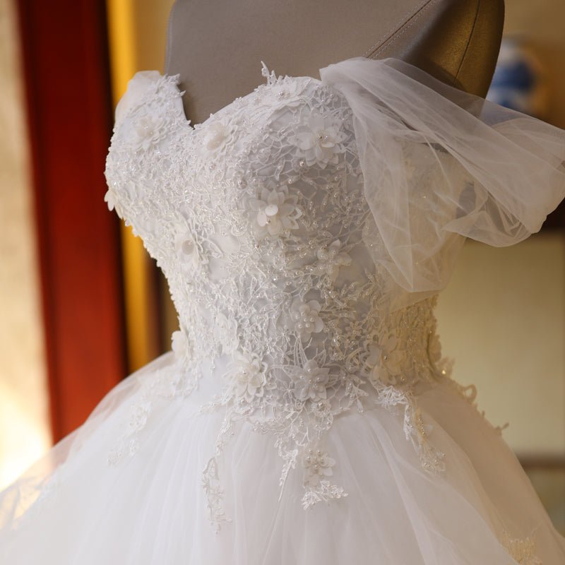 The Bride'S Wedding Dress With Long Tail In Front Of The Studio - RICALOUX