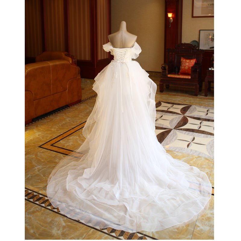 The Bride'S Wedding Dress With Long Tail In Front Of The Studio - RICALOUX