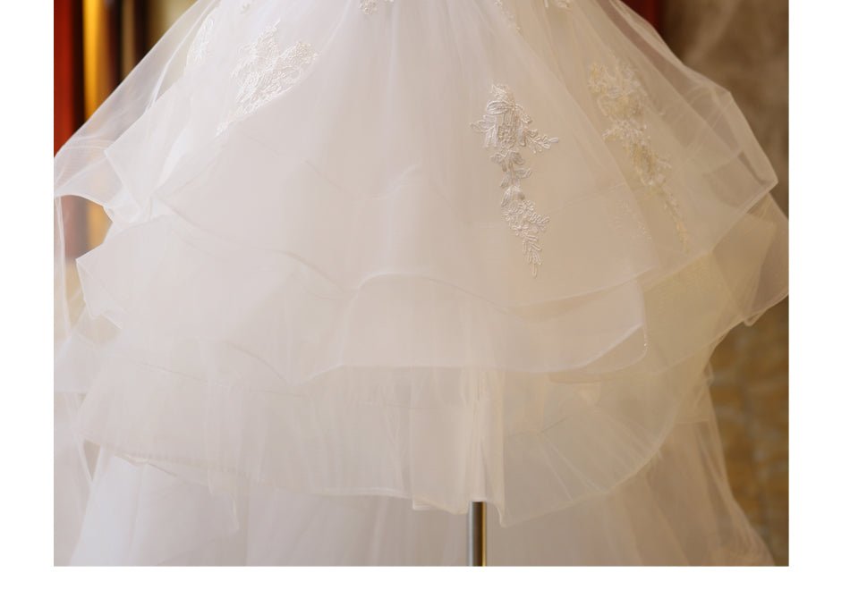 The Bride'S Wedding Dress With Long Tail In Front Of The Studio - RICALOUX