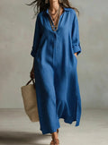 A Beige Linen Shirt Dress With A Relaxed French Vacation Vibe, Featuring A Turned-down Collar With A Half-placket, Rolled-up Sleeves, Side-slit Pockets, And A Long Shirt Dress Designperfect For Trave by Ricaloux