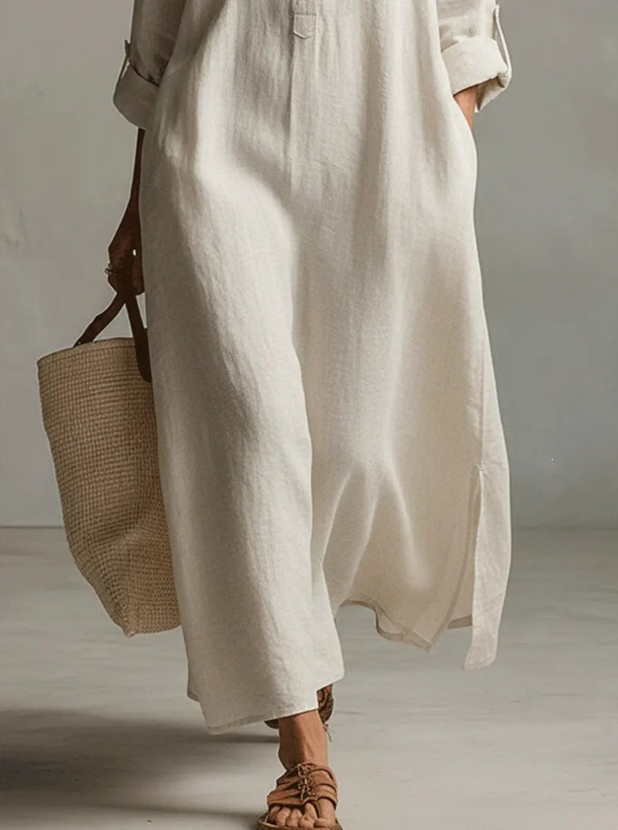 A Beige Linen Shirt Dress With A Relaxed French Vacation Vibe, Featuring A Turned-down Collar With A Half-placket, Rolled-up Sleeves, Side-slit Pockets, And A Long Shirt Dress Designperfect For Trave by Ricaloux