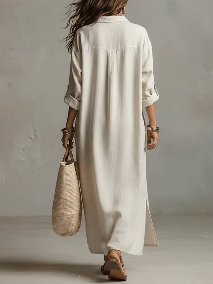 A Beige Linen Shirt Dress With A Relaxed French Vacation Vibe, Featuring A Turned-down Collar With A Half-placket, Rolled-up Sleeves, Side-slit Pockets, And A Long Shirt Dress Designperfect For Trave by Ricaloux