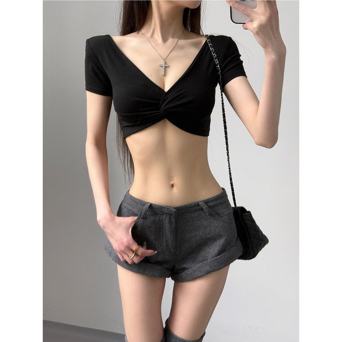 A Short-sleeved T-shirt With A Deep V-neck And A Defined Waistlinea Korean-style Cropped Top Perfect For Layering by Ricaloux