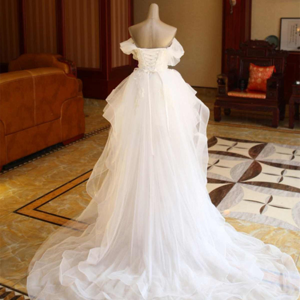 The Bride'S Wedding Dress With Long Tail In Front Of The Studio - RICALOUX