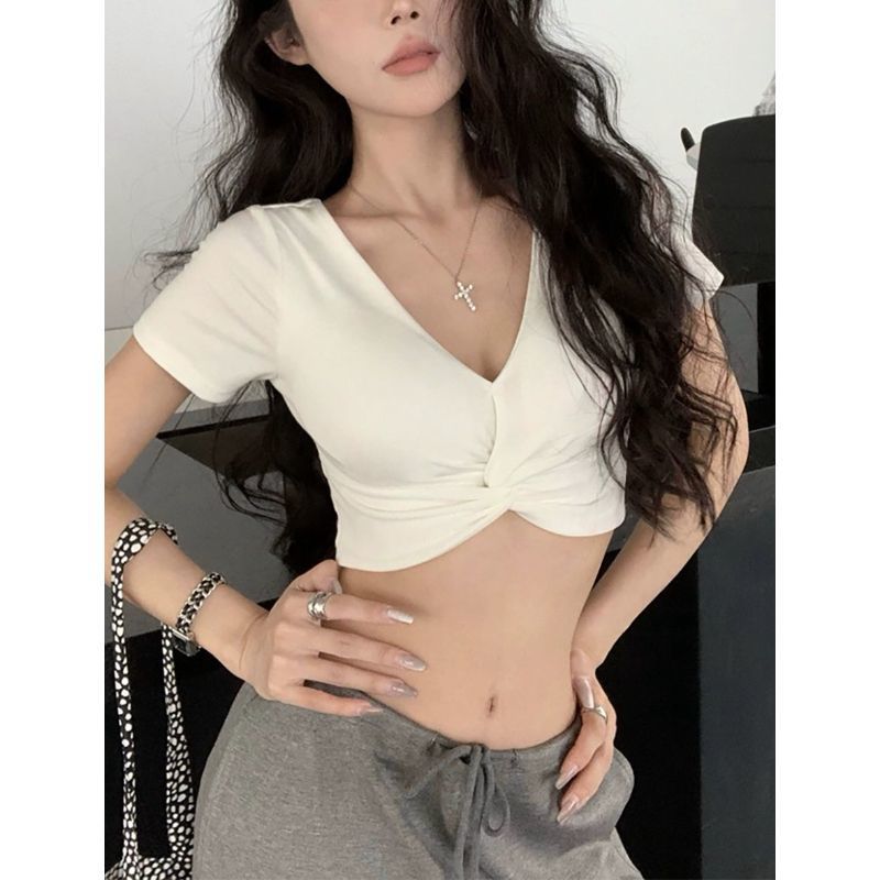 A Short-sleeved T-shirt With A Deep V-neck And A Defined Waistlinea Korean-style Cropped Top Perfect For Layering by Ricaloux