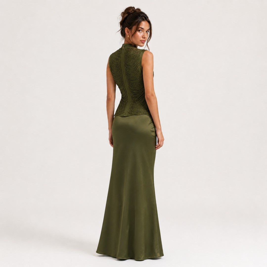 Sleeveless Turtleneck Top With Tassel Detailing Paired With A Satin Midi Skirt by Ricaloux