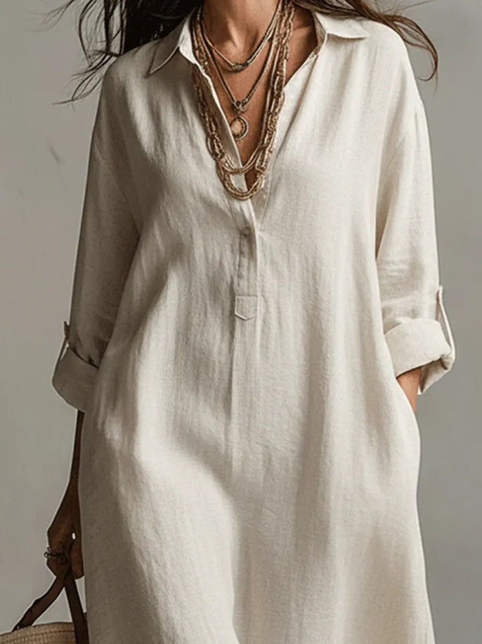 A Beige Linen Shirt Dress With A Relaxed French Vacation Vibe, Featuring A Turned-down Collar With A Half-placket, Rolled-up Sleeves, Side-slit Pockets, And A Long Shirt Dress Designperfect For Trave by Ricaloux